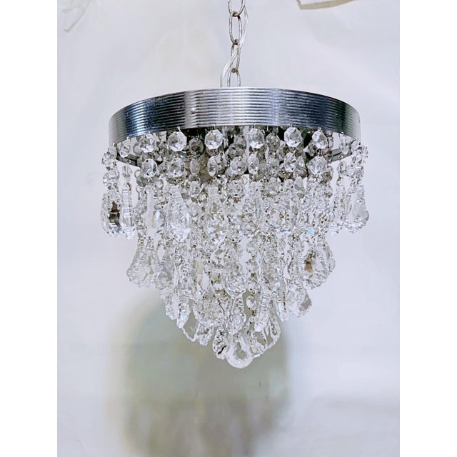 Bring a layer of crisp, mid-century glamour and shimmering brilliance to your interior with this exceptional vintage...