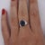 Natural 3.10 Carat Blue Oval-Cut Sapphire with 0.16 CTTW Round-Cut Diamonds in Platinum 900 Size 6 Filigree Setting Split...