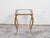 A vintage French gilt metal side table from the mid-20th century, with glass top and cabriole legs. Created in France...