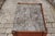 A French walnut tambour door side table from the mid-19th century, with variegated grey marble top and tapered legs. Born...