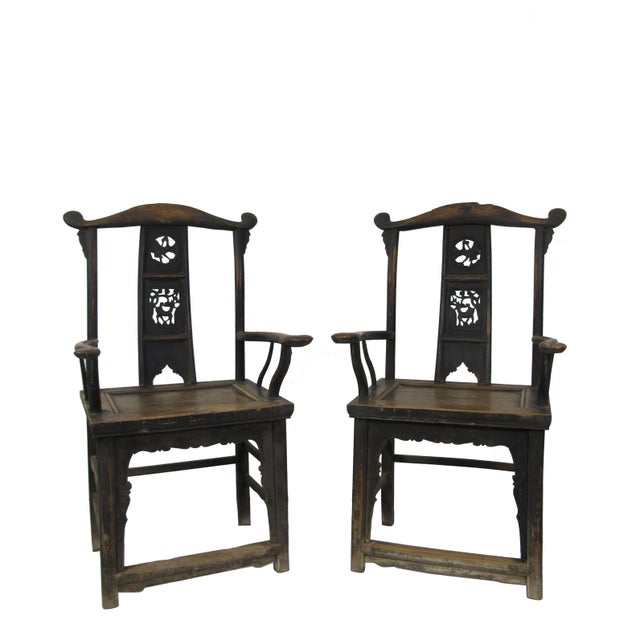 This antique Chinese high yoke back armchair has a back splat adorn with nicely carved dear, crane, flowers on the branch...