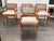 Design Plus Gallery presents a Set of Four Vintage and Neoclassical Influenced Armchairs. The chairs are made from solid...