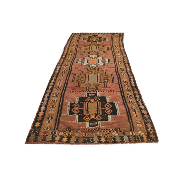 Decorative handwoven vintage kilim rug from Kars region of Turkey. Approximately 50-60 years old. In very good condition.