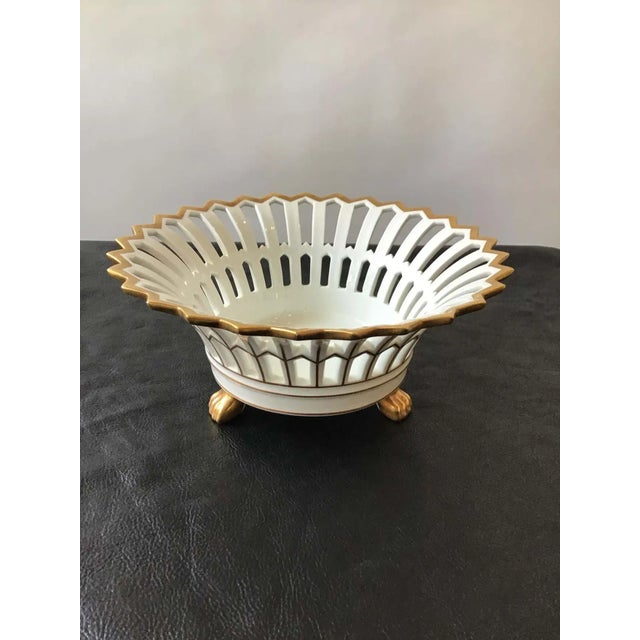 Ceramic Portuguese lattice bowl with gilt lion paws.