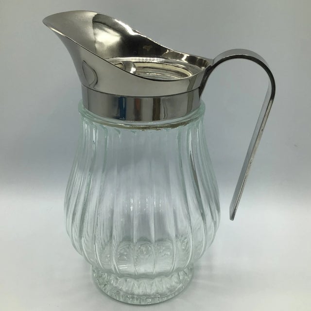 Wonderful molded glass bottom with a removable one piece silver plated pour spout and handle. This pitcher holds 26 ounces...
