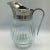 Wonderful molded glass bottom with a removable one piece silver plated pour spout and handle. This pitcher holds 26 ounces...