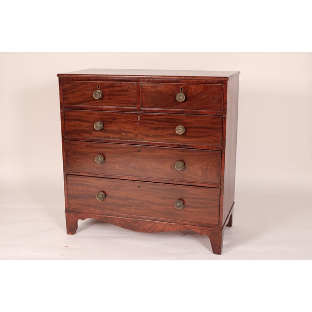 George III mahogany chest of drawers, early 19th century. With a rectangular two board top, 2 top drawers and 3 graduated...