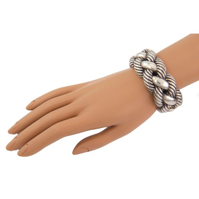 This is a chic authentic wide cuff bracelet from David Yurman, crafted from sterling silver and has a flex open on one end...