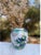 This Kutani Japanese ceramic vase features a graceful blue bird motif, beautifully hand-painted in rich cobalt tones. Fine...