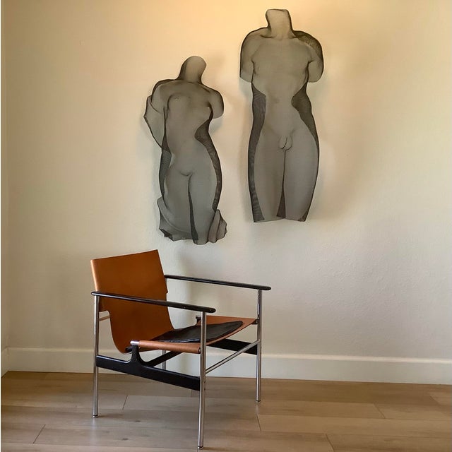 A striking and highly collectible matched pair of original wire mesh wall sculptures by acclaimed American artist Eric...