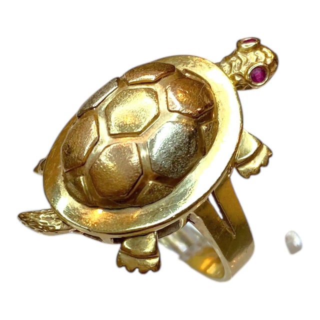 Crafted in 14K yellow gold, the ring features an articulating turtle (head, legs and tail move) motif. The turtle's eyes...