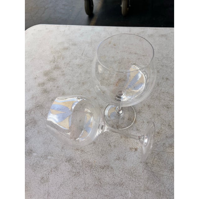 Add a touch of timeless mid-century elegance to your tabletop or bar cart with this sophisticated pair of Marquis by...