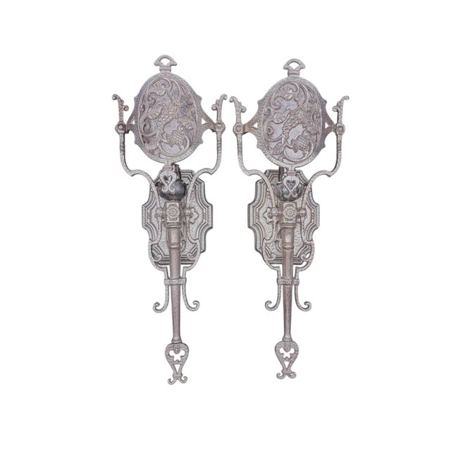 We were shocked to strip off the black paint from these sconces and find the original nickel plating underneath! Now...