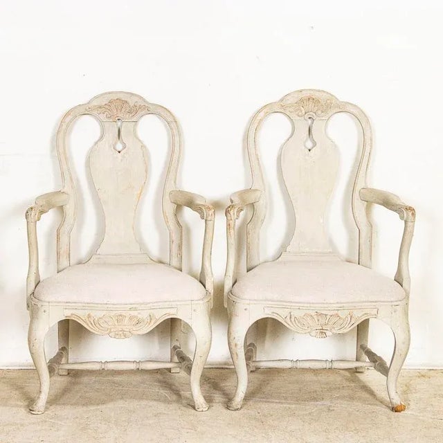 The gracious curves seen in these two arm chairs are reflective of Sweden's love of Rococo styling. Curved backs,...