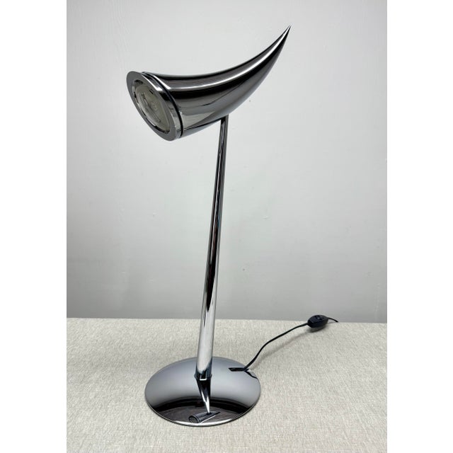 Designer Philippe Starck (b. 1949). The Ara table lamp, named for Starck’s eldest daughter, is one of several lighting...