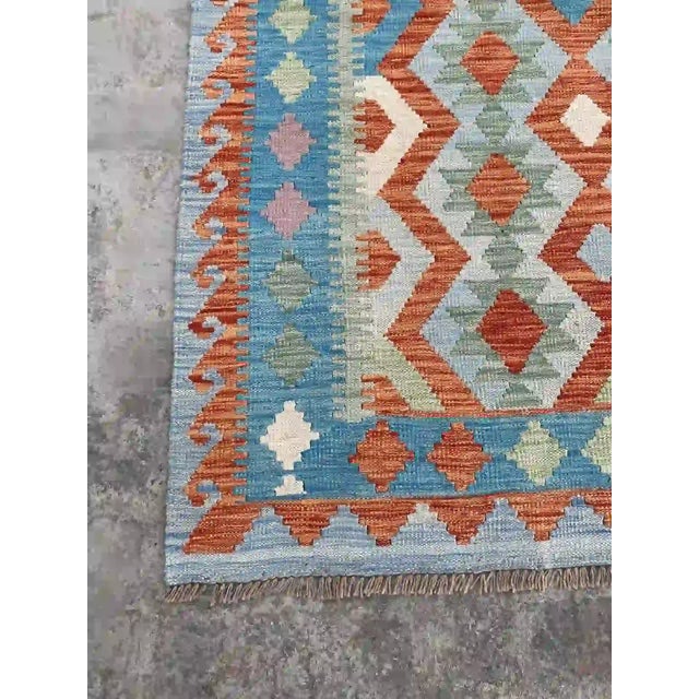Orange Hand-Woven Afghan Kilim Rug | Vibrant Geometric Design in Blue and Orange For Sale - Image 8 of 11