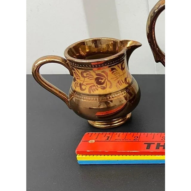 Pretty petite antique Staffordshire Copper Lustreware creamer with a hand-painted gold band at neck with a line of beading...