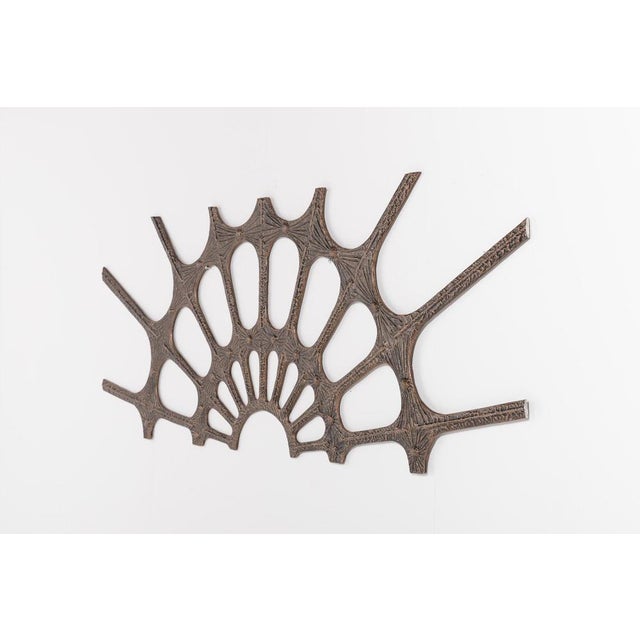 Casted and coated metal Brutalist wall decoration. It can be used horizontally or vertically. Previously used as door...