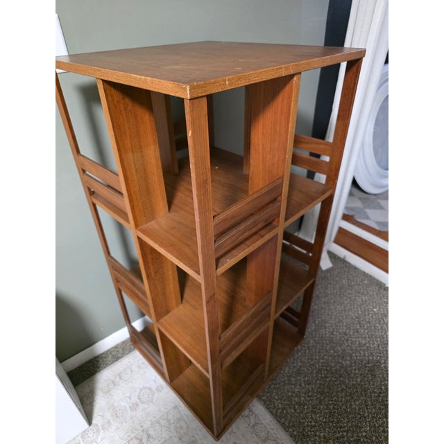 Up for sale is a stunning, highly collectible Mid- Century Modern Scandinavian revolving bookcase dating from the...