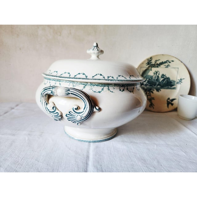 Antique French soup tureen made by Sarreguemines. It is a rare item of terre de fer, ironstone, from the Faust series,...
