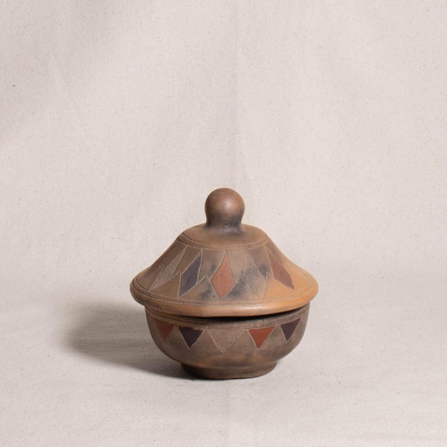 Vintage Hand Carved and Painted Geometric Lidded Earthenware Pottery Bowl This ceramic bowl features a rounded base with a...