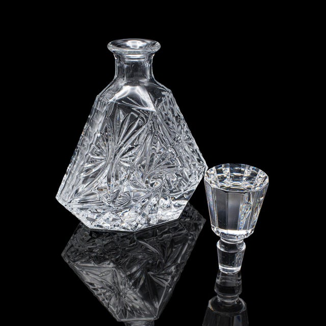 This is a vintage liqueur decanter. An English, cut crystal glass spirit bottle, dating to the late 20th century, circa...