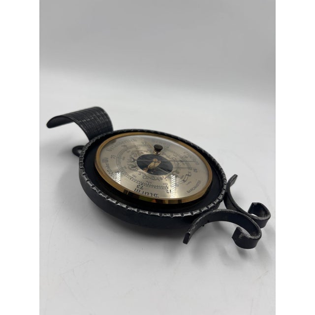 Wall barometer with integrated thermometer in a triangular wooden case (house-shaped) with a reddish stain and brass...