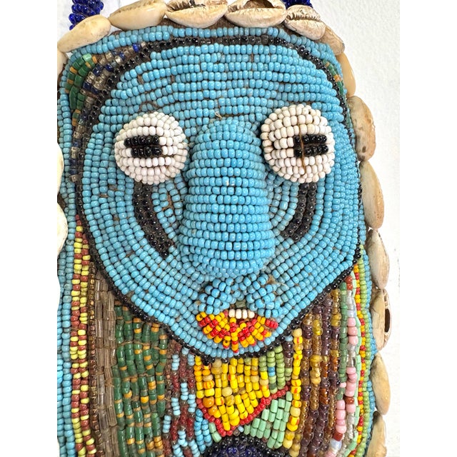 Colorful and captivating wall hanging from Nigeria. These panels are hand-crafted to symbolize spiritual entities, serving...