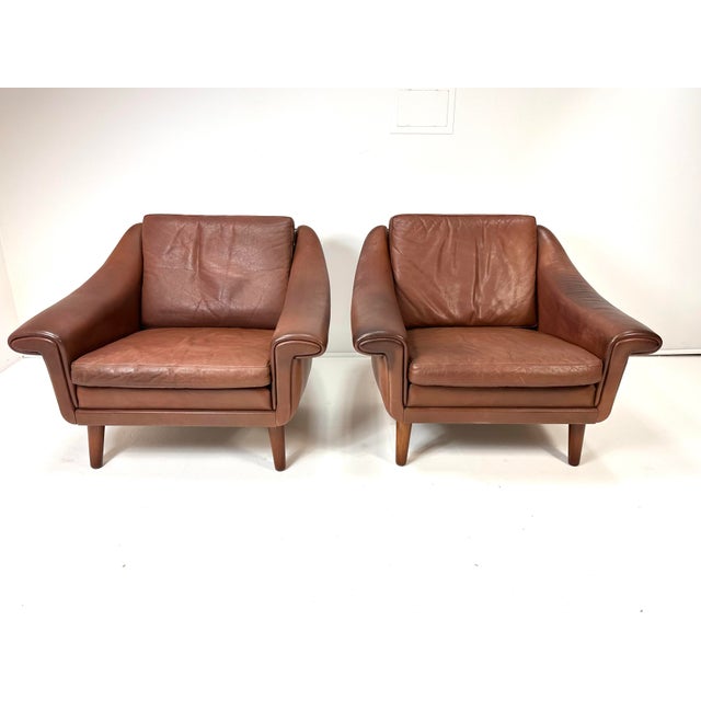 Pair of 1960's Danish Leather Lounge Chairs by Aage Christiansen for Erhardsen & Andersen. Stained Teak legs. Made in...