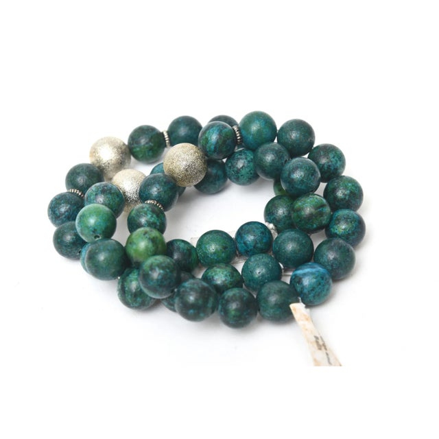 This is part of Chairish’s Costume Jewelry assortment. This set of 3 custom turquoise beaded stretch bracelets with silver...