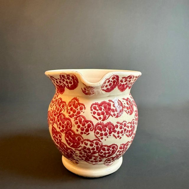 Pour love into every gathering with this charming heart-patterned ceramic pitcher! This delightful pitcher features a...