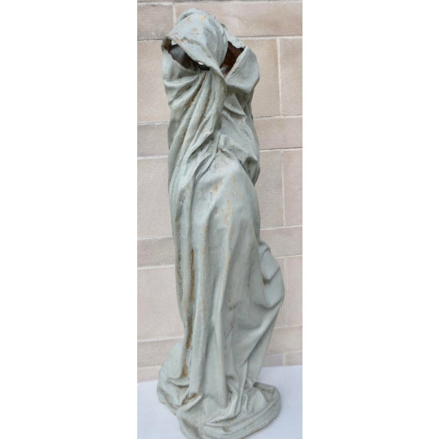 Lifesize Cast toga over an invisible female form. Large sculpture handled for exterior display or patio use. Cast in...