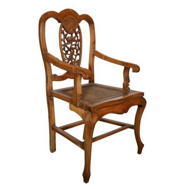 A Chinese 19th century armchair with hand-carved medallion pierced back splat. This Chinese 19th century wooden armchair...