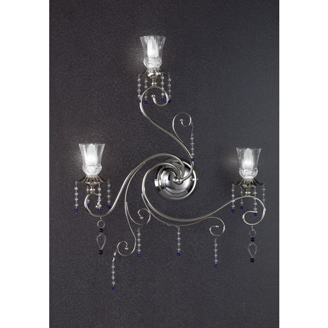 Fenice crystal 3 lights wall sconce in polished chrome and glass by aggiolight. Dimensions: w 59 x d 12 x h 63 cm....