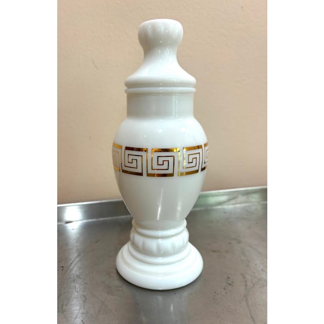 1960s milk glass lidded jar/urn w/ greek key detail. Excellent condition.