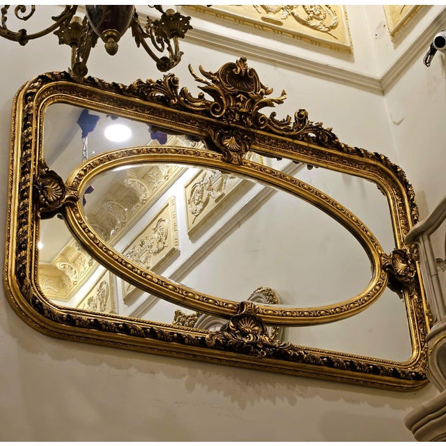 Bring timeless French elegance into your home with this magnificent Rococo-style wall mirror, featuring an impressive oval...