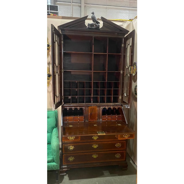 Very good inlaid Georgian secretary with a falconer pediment, probably by Gillows. The secretary features glazed doors...