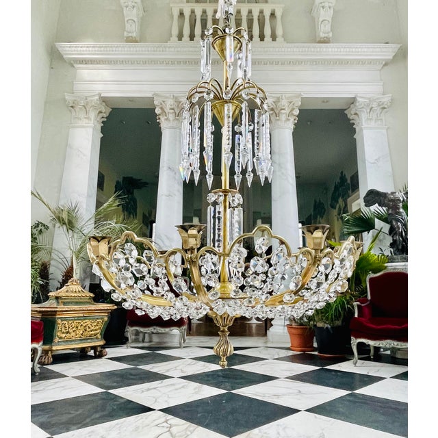 English 8 arm Crystal and Bronze Chandelier in the form of a fountain. The frame is well build, out of solid bronze. The...