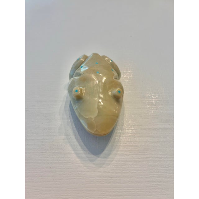 Territorial Indian Arts & Antiques:This is a Zuni Frog Fetish carving crafted from a pale stone, likely Angelite or...