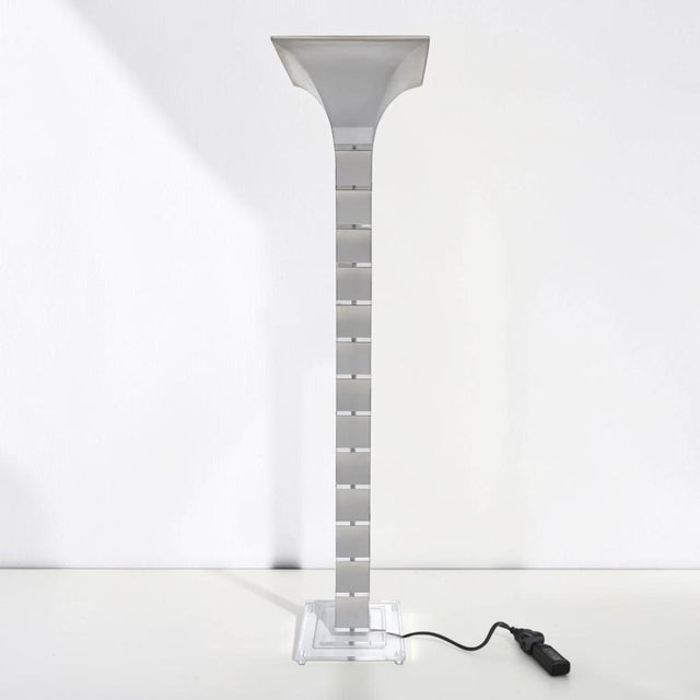 Fabulous post-modern lucite floor lamp. This lamp is unique and has stacked clear lucite blocks, with stacked frosted...