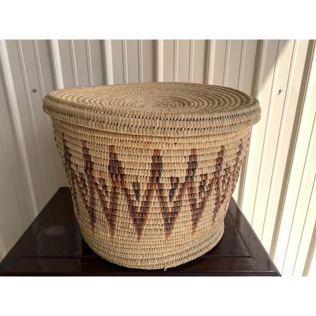 Large-scale vintage coiled basket from Kenya. Typically crafted by the Turkana people using traditional weaving...