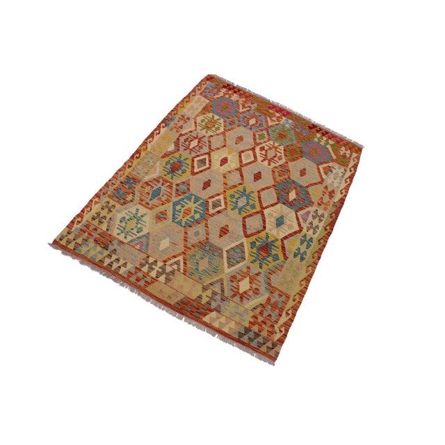 Add a touch of elegance to your home with this casual chic hand woven Tribal Kilim wool rug. Constructed on a loom by...