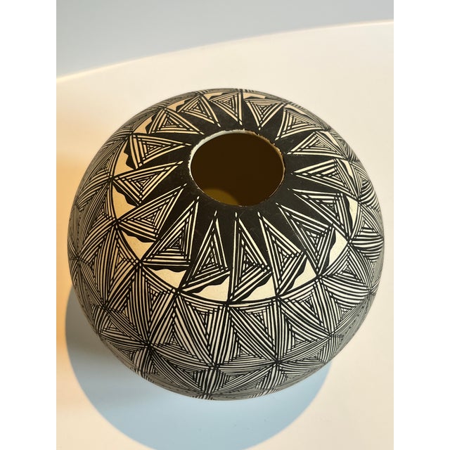 This vase, by renowned Acoma artist Lydia H. Ray, measures 5" round perfectly and displays a highly detailed and intricate...
