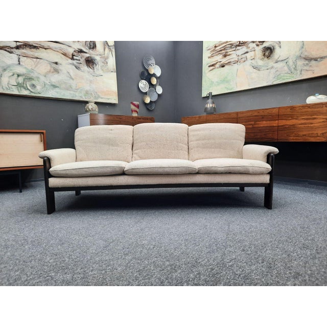 A lovely vintage sofa from the sixties. The design is reminiscent of the Bastiano model by Topia Scarpa. It's upholstered...