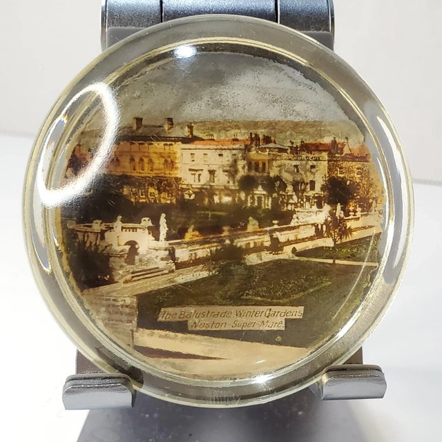 This is a wonderful English souvenir glass paperweight depicting the famous Winter Gardens Pavillion at the Weston Super...