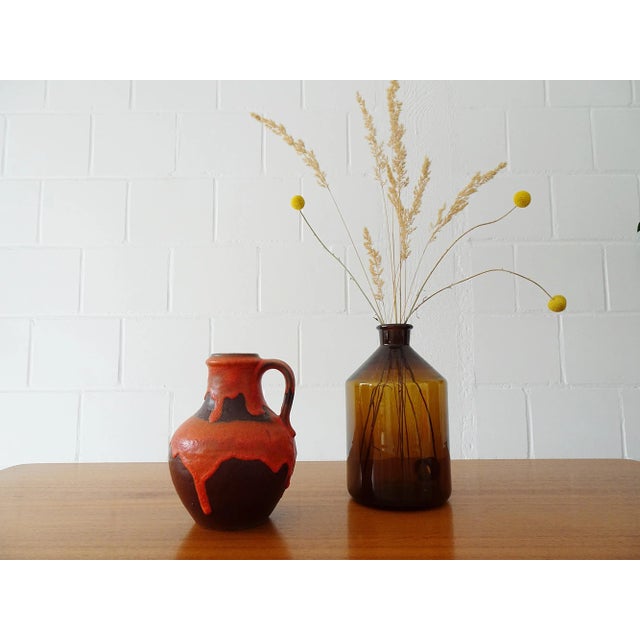 Ceramic Henkel Vase Carstens Tönnieshof in exceptional decoration. The brown Krug Vase has a thick fat layer Lava orange...