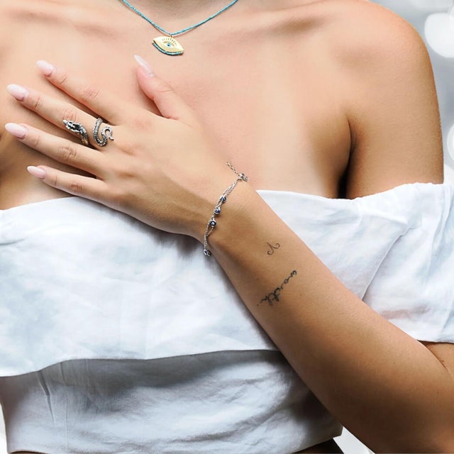 The Triple Chain Evil Eye Sterling Silver Bracelet is a graceful harmony of style, spirituality, and symbolism. it's a...