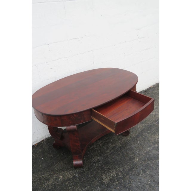 This great Desk is made of wood, solid wood, cherry, mahogany, and veneer. This desk is an excellent example of Empire...