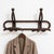 A refined Italian wall-mounted coat rack from the early 20th century, crafted from walnut and featuring an elegant Art...