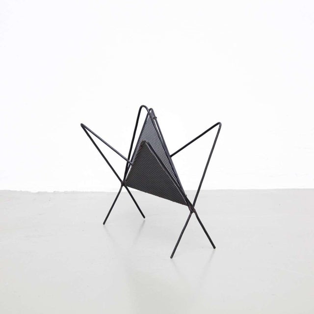 Magazine holder, designed by Mathieu Matégot. Manufactured by Ateliers Matégot (France), circa 1950. Folded, perforated...